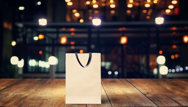 paper bag for shopping on a wooden background