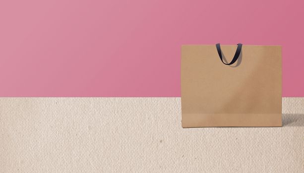 paper bag for shopping on a pink background