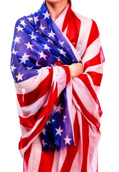 Woman's body wrapped in the USA national flag, isolated on white background
