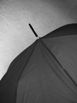 BLACK AND WHITE PHOTO OF CLOSE-UP OF UMBRELLA