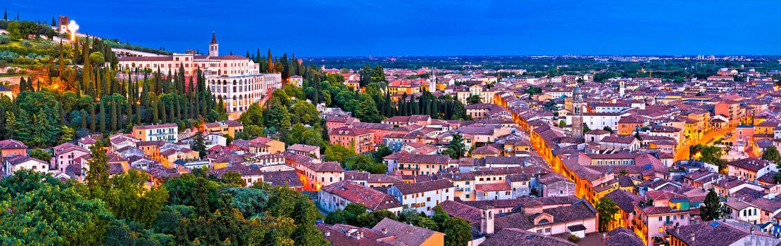 Verona old city and Adige river panoramic aerial view at evening, Veneto region of Italy