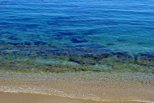 Crystal clear water of the mediterranean sea with underwater rocks