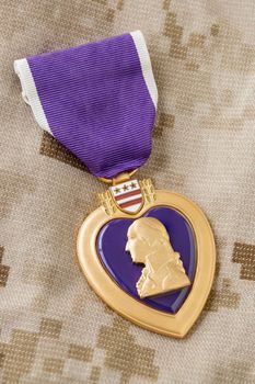 Purple Heart Medal Laying on Military Fatigues