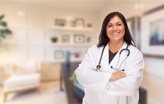 Female Hispanic Doctor or Nurse Standing in Her Office.