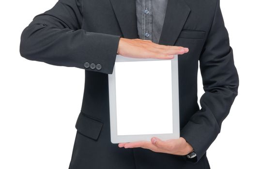 Businessman holding tablet in black suit on white background