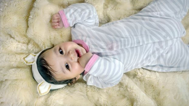 Asian cute baby girl lying on the bed