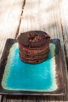 Creamy chocolate mousse layered cake with rich fudge icing