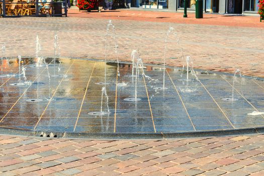 Fountain, water play in a pedestrian zone.