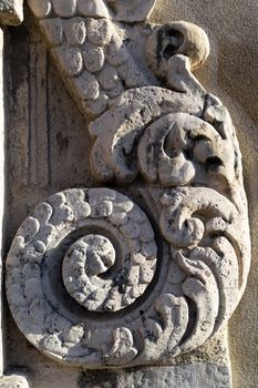 Detail of old house in baroque style in Italy