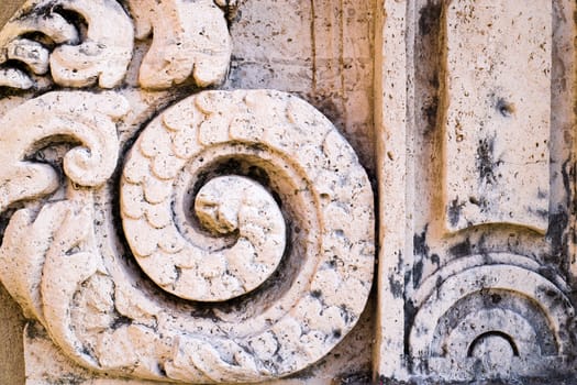 Detail of old house in baroque style in Italy