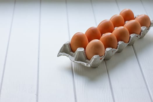 Eggs in the paper tray package on white background.