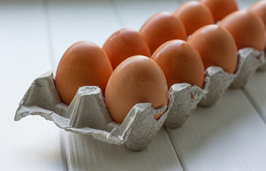 Eggs in the paper tray package on white background.