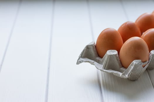 Eggs in the paper tray package on white background.