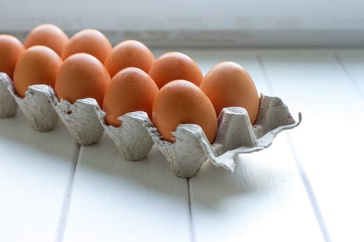 Eggs in the paper tray package on white background.