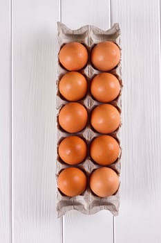 Eggs in the paper tray package on white background.