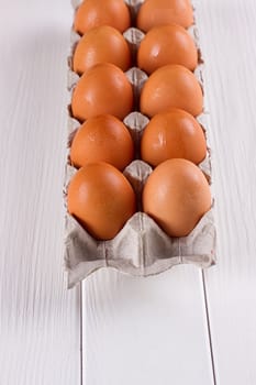 Eggs in the paper tray package on white background.