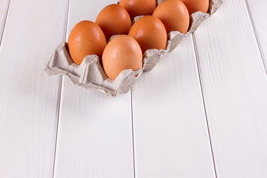 Eggs in the paper tray package on white background.