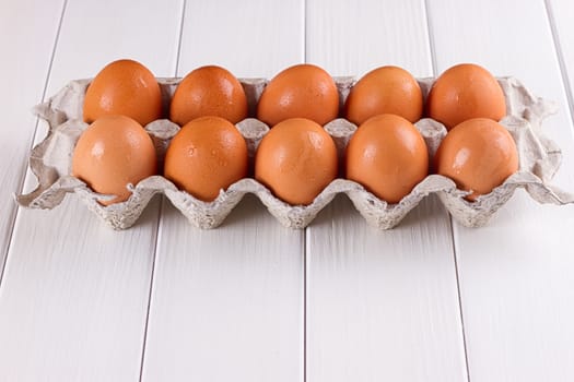 Eggs in the paper tray package on white background.