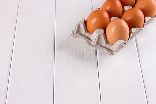 Eggs in the paper tray package on white background.