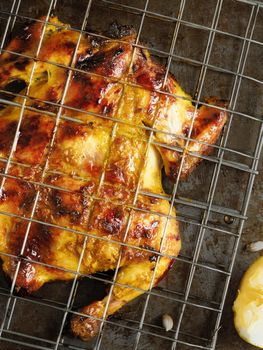 close up of rustic barbecued whole chicken