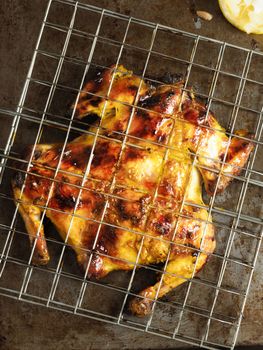 close up of rustic barbecued whole chicken