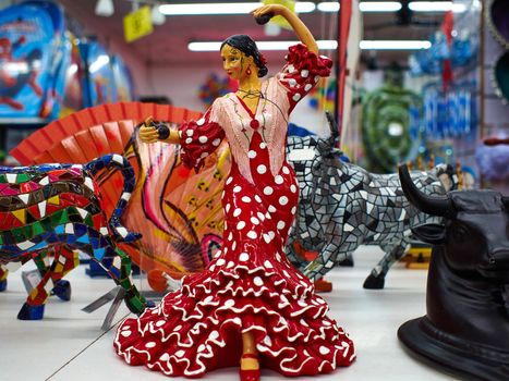 Figurine of a traditional Spanish Flamenco dancer as a tourist souvenir in a shop