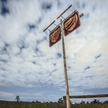 Rusted fuel station sign in the countryside of Brisbane, Queensland.