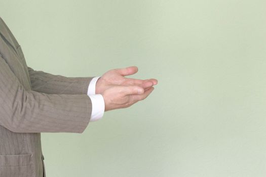 Business training concept. Photo for your design. The man is holding his hands in profile