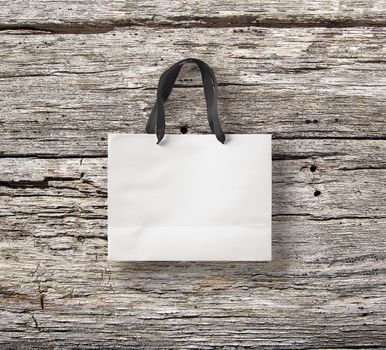 paper bag for shopping on a wooden background