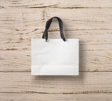 paper bag for shopping on a wooden background