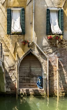 Old building along canals in Venice, Italy