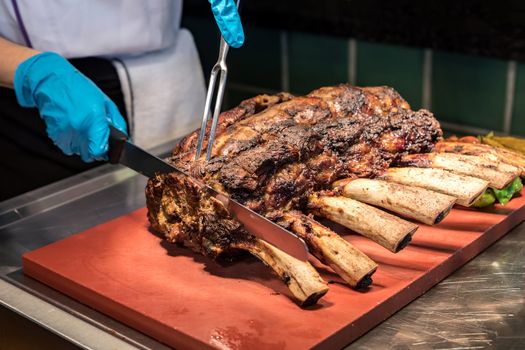 Chef Carving prime rib of  roast Wagyu beef 