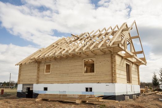 Wooden house under construction. Poland.