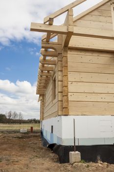 Wooden house under construction. Poland.