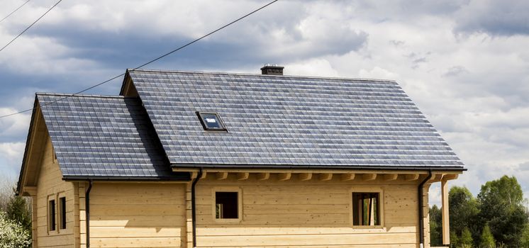 Wooden house with gray tiled roof