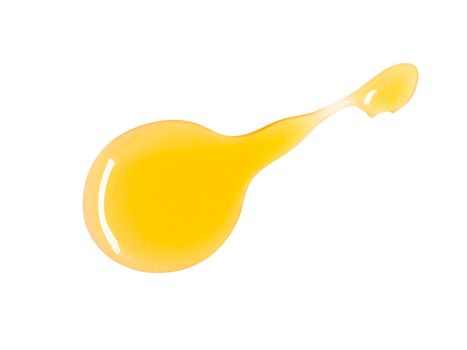 Closeup top view sweet honey drop isolated on white background with clipping path