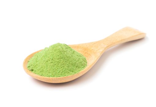 Green matcha tea powder on wooden spoon with white background