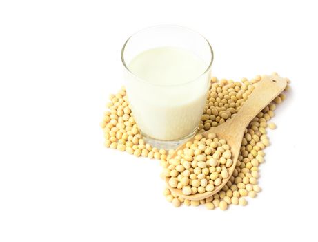 Glass soy milk and soy beans with heart shape on white background, food and drink healthy concept