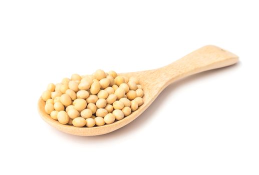 Soy beans on wood spoon with white background