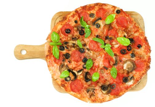 Homemade Pepperoni Pizza with Mushrooms, Black Olives, Ham and Basil on Wooden Cutting Board on White background. Top View