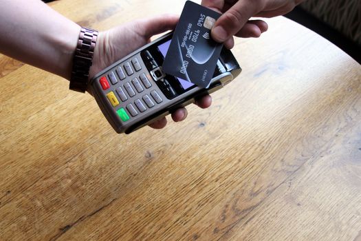 contactless payment card pdq background copy space with hand holding credit card ready to pay