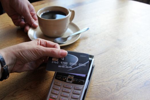 contactless payment card pdq background copy space with hand holding credit card ready to pay