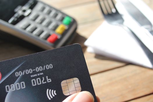 contactless payment card pdq background copy space with hand holding credit card ready to pay