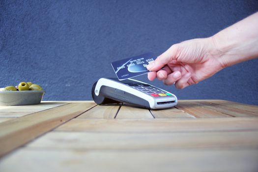 contactless payment card pdq background copy space with hand holding credit card ready to pay