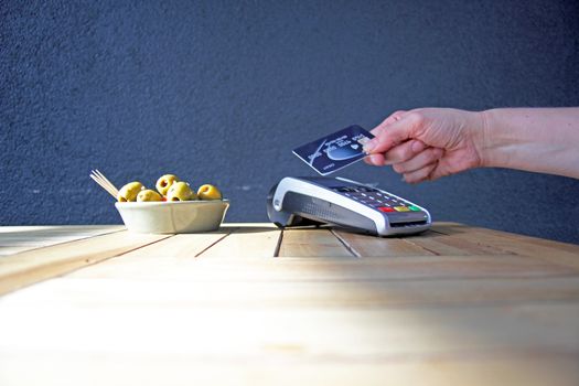 contactless payment card pdq background copy space with hand holding credit card ready to pay