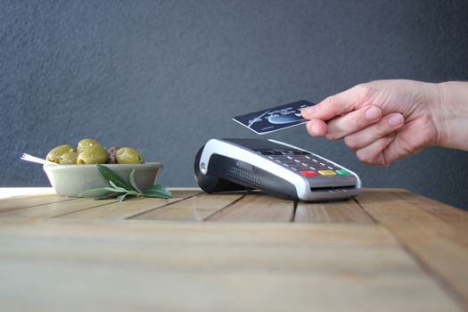 contactless payment card pdq background copy space with hand holding credit card ready to pay