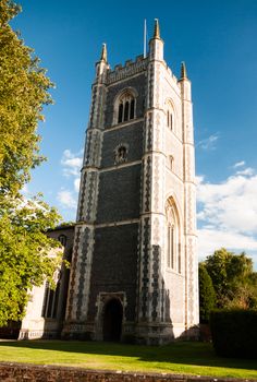 a view of dedham church in summer light with a beautiful blue clear sky; UK