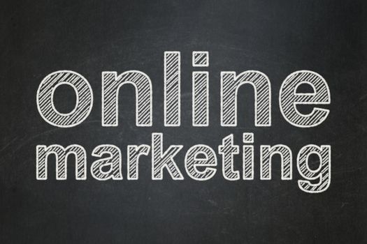 Advertising concept: text Online Marketing on Black chalkboard background