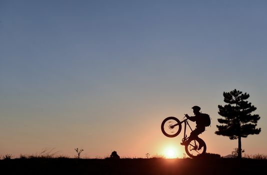 lone cyclist and sunrise peace