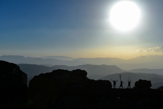 Successful mountaineering group in the summit mountains